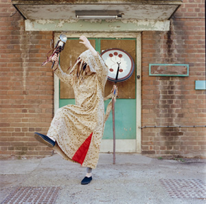 Cloak (performance)<br />2014 Hand silk screened antique fabric and vintage ribbon (photo by Rick Pushinsky)